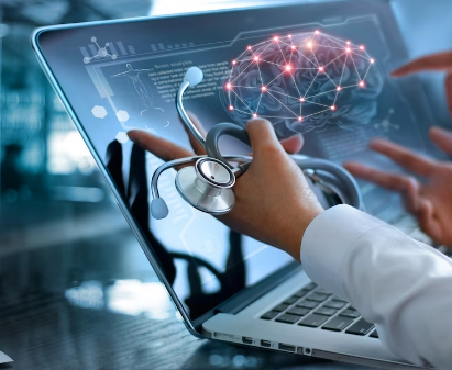 hand holding a stethoscope gesturing toward laptop screen